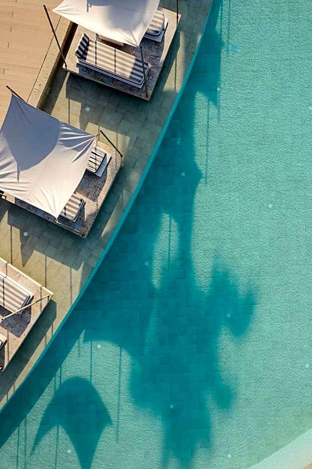 Blue Carpet Luxury Suites cinematic pool view